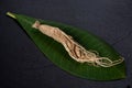 Ginseng on black ceramic background Royalty Free Stock Photo