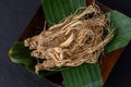 Ginseng on black ceramic background Royalty Free Stock Photo