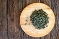 Ginseng Green Oolong Tea on wooden board