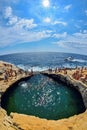 GIOLA, THASSOS, GREECE - AUGUST 2015: Tourists bathing in the Giola. Giola is a natural pool in Thassos island, August 2015, Gree