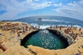 GIOLA, THASSOS, GREECE - AUGUST 2015: Tourists bathing in the Giola. Giola is a natural pool in Thassos island, August 2015, Gree Royalty Free Stock Photo