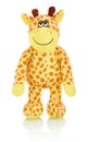 Giraffe plushie doll isolated on white background with shadow reflection. Giraffe plush stuffed puppet on white backdrop. Royalty Free Stock Photo