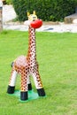 Giraffe Statue on the green field