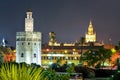 Giralda tower of Seville cathedral and Tower of Gold at night, Seville, Spain Royalty Free Stock Photo