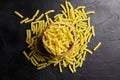 Girandole pasta in wooden bowl on black table Royalty Free Stock Photo