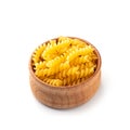 Girandole pasta in a wooden cup. White background Royalty Free Stock Photo