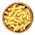 Girandole torsades pasta in wooden bowl over white Royalty Free Stock Photo