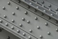 Girder with rivets