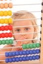 Girl and abacus Royalty Free Stock Photo