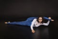 Girl acrobat, gymnastics, a young athlete in a blue and white suit , practicing acrobatics. images on white background