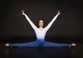 Girl acrobat, gymnastics, a young athlete in a blue and white suit , practicing acrobatics. images on white background