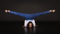 Girl acrobat, gymnastics, a young athlete in a blue and white suit , practicing acrobatics. images on white background