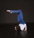 Girl acrobat, gymnastics, a young athlete in a blue and white suit , practicing acrobatics. images on white background