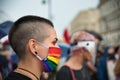 Girl activist wearing rainbow face mask during LGBT demonstration