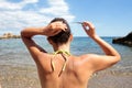 Girl adjusting her hair on beach Royalty Free Stock Photo