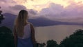 Girl admires the lake from above. Bali, Bedugul