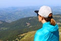 A girl admires the view from the summit of Mount Cimone at 2,165 meters above sea level