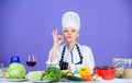 Girl adorable chef teach culinary. Best culinary recipes to try at home. Perfect recipe. Turn ingredients into delicious Royalty Free Stock Photo