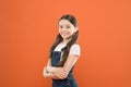 Girl adorable kid stand over orange background. What is key to childhood happiness. Happy childhood. Grow mentally and