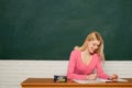 Girl adorable teacher sit classroom chalkboard background copy space. School education. Formal education. Woman student