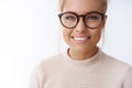 Girl adores new glasses picked in optician store standing happy and delighted against white background smiling satisfied