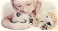 Girl affectionately hugging kitten and Puppy Royalty Free Stock Photo