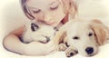 Girl affectionately hugging kitten and Puppy Royalty Free Stock Photo