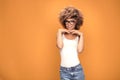 Girl with afro hairstyle wearing fashionable eyeglasses. Royalty Free Stock Photo