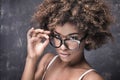 Girl with afro wearing eyeglasses. Royalty Free Stock Photo