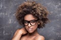 Girl with afro wearing eyeglasses. Royalty Free Stock Photo