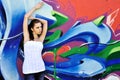 Girl against grafitti wall Royalty Free Stock Photo
