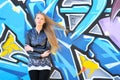 Girl against grafitti wall Royalty Free Stock Photo