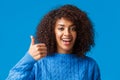 Girl agress with you. Close-up portrait cute african-american female with afro, curly haircut showing thumb-up in Royalty Free Stock Photo