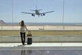 Girl at the airport window Royalty Free Stock Photo