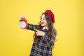 Girl with alarm clock. Set up alarm clock. Child little girl hold red clock. It is time. Always on time. It is never too