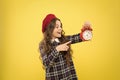 Girl with alarm clock. Set up alarm clock. Child little girl hold red clock. It is time. Always on time. It is never too