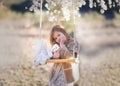 Girl with almond flowers in the gardens. Royalty Free Stock Photo