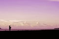 a girl alone on the beach at dusk. A girl is enjoying me time Royalty Free Stock Photo