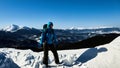 Girl alone travels the winter mountains with a backpack Royalty Free Stock Photo