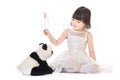 Girl with angel wings casting spell on a panda Royalty Free Stock Photo