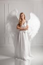 Girl with angel wings in white dress