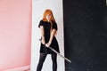 Girl sword Japan cosplayer anime red hair Royalty Free Stock Photo