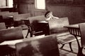 Girl at antique school desk Royalty Free Stock Photo