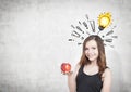 Girl with apple, exclamation marks and bulb