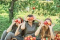 Girl with Apple in the Apple Orchard. Beautiful Girl Eating Organic Apple in the Orchard. Harvest Concept. Garden, teenager eating