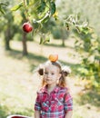 Girl with Apple in the Apple Orchard