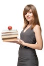 Girl with the apple and a stack of books Royalty Free Stock Photo