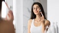Girl Applying Blusher Using Cosmetic Brush In Bathroom, Panorama Royalty Free Stock Photo