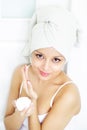 Girl applying cream on skin Royalty Free Stock Photo
