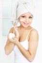 Girl applying cream on skin Royalty Free Stock Photo